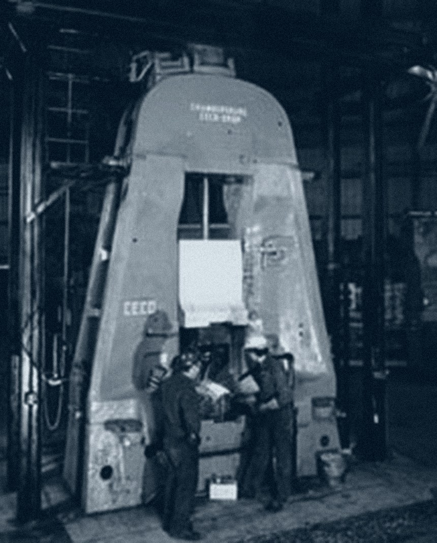 Chambersburg drop hammer on the Lincoln Forge floor with two forge operators